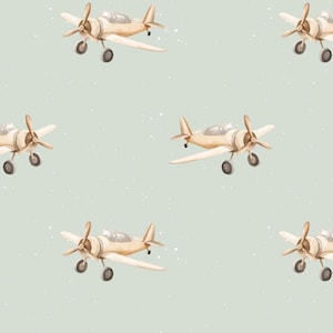 Peut inclure: Un motif sans couture représentant des avions jouets brun clair répétés sur un fond bleu clair avec des points blancs.