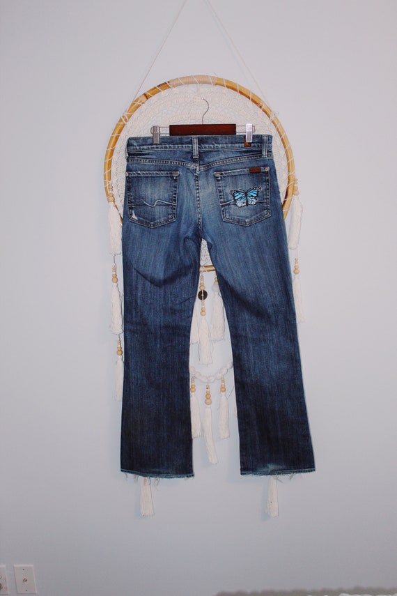 Jeans con tasca dipinta outlet