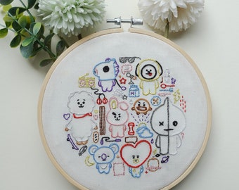 May include: Embroidered hoop art featuring a variety of colorful cartoon characters, including a white fluffy character with a red scarf, a pink bunny, a brown bear, and a black and white character with an X on its face. The characters are surrounded by various small details, such as hearts, stars, and clouds.