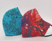 Turquoise Tribute N95 grade filter lined cloth face mask, adjustable, reversible, washable, and reusable.