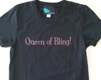 Limited Edition black-color cotton, short sleeve, unisex, Tshirt printed with pink-color glitter "Queen of Bling!" size M, chest 31"