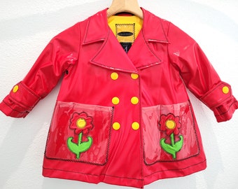 Vintage-1990s cute children's stretchy vinyl cotton-lined trapeze rain jacket with embroidered and appliqued pockets, kids size 4T raincoat