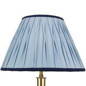 Handmade silk empire lampshade in vintage blue with navy blue trim. Box pleated , smocked