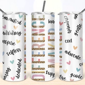 May include: Three white stainless steel tumblers with different designs. The first tumbler has a white background with pink, blue, and yellow hearts and words like "committed", "inspiring", and "selfless". The second tumbler has a leopard print background with the word "difference" in colorful letters. The third tumbler has a white background with pink, blue, and yellow hearts and words like "empower", "cool", and "guide".