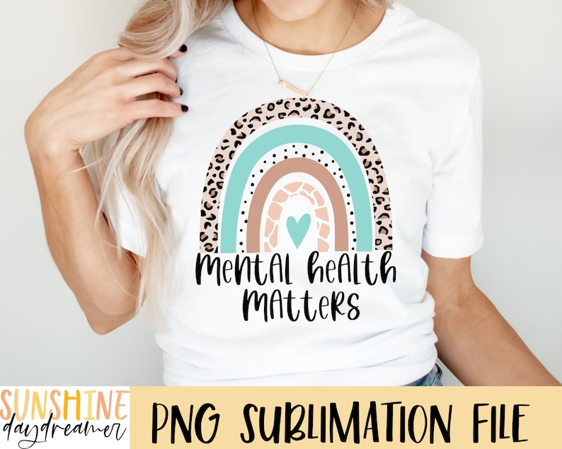 May include: A white t-shirt with a rainbow design featuring a heart and the text "Mental Health Matters".