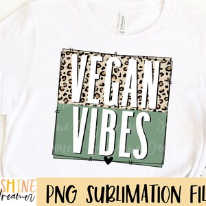 May include: A sublimation design featuring the text "Vegan Vibes" in white letters on a green background with a leopard print pattern on top.