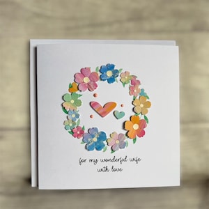 May include: A rustic wooden sign with the text "Welcome to our home" in white lettering. The sign features a distressed finish and a simple, inviting design, perfect for entryway decor.