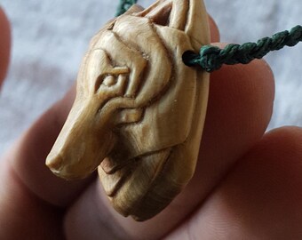 Handcarved wolf pendant from juniper wood, with adjustable length