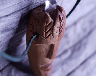Handcarved Juniper Wood Pendant: nature spirit with Leaf hair and a  Quartz Crystal point
