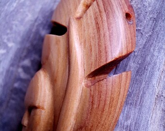 Hand-Carved Juniper Wood  Pendant: feather with a small face at the base