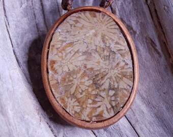 Handcarved Greek Island Coral Fossil Encased in Juniper Wood Pendant. With adjustable chord.