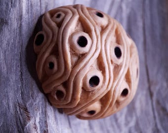 Handcarved Juniper Wood Pendant: Arbutus Eye Motif, Adjustable Cord