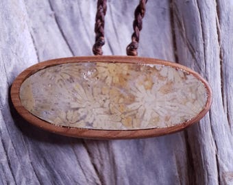 Handcarved Greek Island Coral Fossil Encased in Juniper Wood Pendant. With adjustable chord.