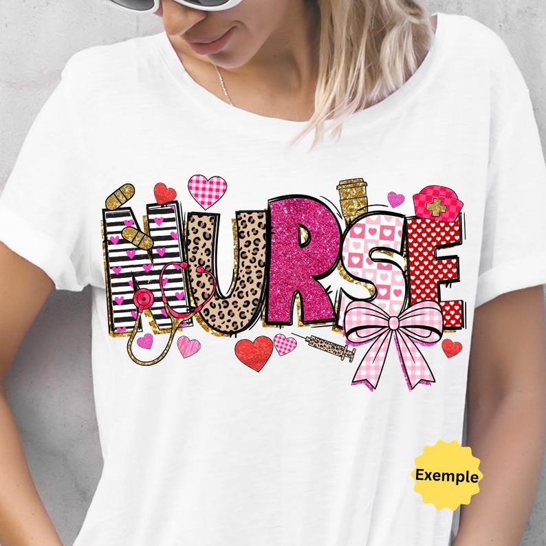 May include: White t-shirt with a pink and gold graphic that says "NURSE" with hearts, a stethoscope, a syringe, and a bow. The graphic is surrounded by small pink hearts.