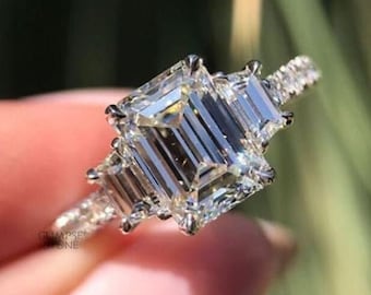Emerald Cut Moissanite 3 Stone Ring: Trapezoid Trellis Setting