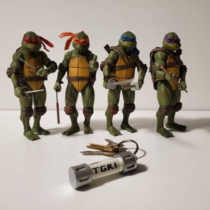 TMNT Glow in the Dark-sleutelhanger - TGRI Ooze-bus