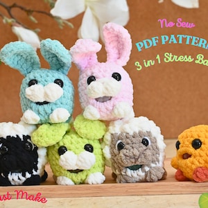 May include: A collection of handmade, colorful stress balls in the shape of animals. The stress balls include bunnies, sheep, and a chick, with the text "No Sew PDF Pattern 3 in 1 Stress Balls" and "Fast Make".