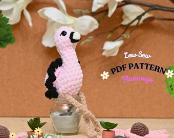 May include: A pink crocheted flamingo amigurumi toy with black accents. The toy is sitting in a glass jar filled with sand. The image includes the text "Low Sew PDF PATTERN Flamingos".