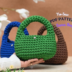 May include: A green, blue, and brown crochet bag with a rounded handle and a silver snap closure. The bags are displayed on a neutral background. Text on the image reads "No Sew PDF Pattern Luma Bag."