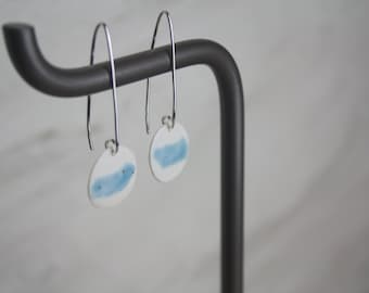 Short sterling silver earrings with paintbrush sweep of blue glaze | simple, minimalist, bright white