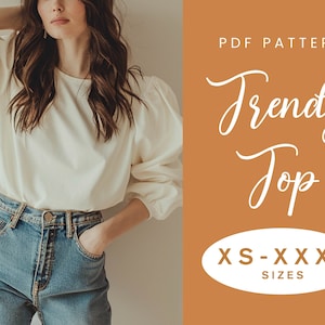 Peut inclure: Un patron de couture PDF blanc pour un haut tendance à manches bouffantes. Le patron comprend les tailles XS-XXXXL. L'image montre un mannequin portant un haut blanc et un jean bleu.