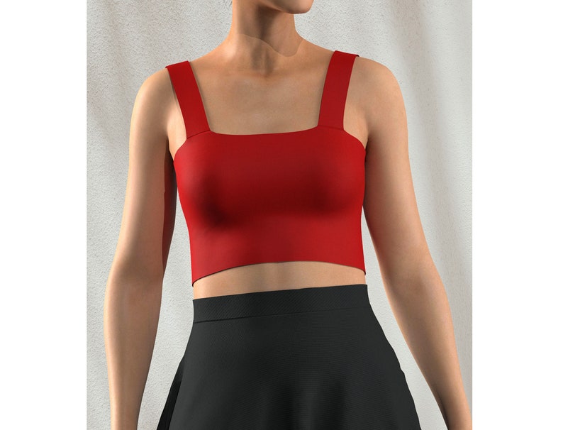 May include: A red cropped tank top with wide straps. The top is made of a smooth, stretchy fabric.