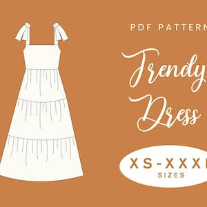 以下が含まれることがあります： 暖かい茶色の背景に、白いティアードドレスのイラスト。肩紐は結び目、上部に「PDF PATTERN」、筆記体で「Trendy Dress」の文字。XS-XXXLのサイズ展開。