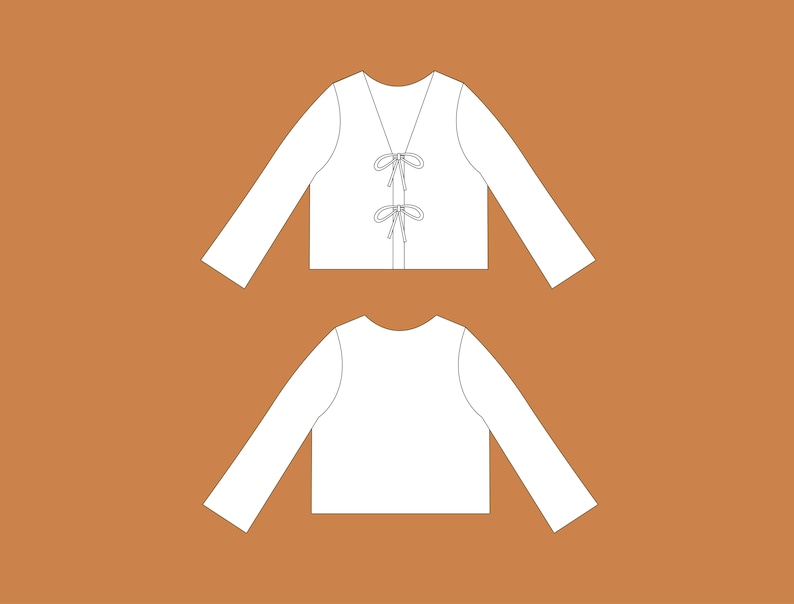 May include: A white long-sleeved shirt with a V-neck and a tie detail at the front.