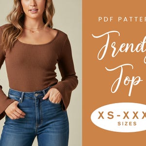 May include: A brown, long-sleeved top with a scoop neckline and flared sleeves. The top is paired with blue jeans. Text on the image reads "PDF Pattern Trendy Top" and "XS-XXXL SIZES".