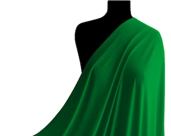 May include: A vibrant green fabric draped over a mannequin. The fabric is smooth and has a slight sheen.