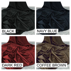 May include: Four fabric swatches in different colors: black, navy blue, dark red, and coffee brown. The fabric is smooth and has a slight sheen.