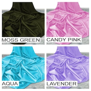 May include: Four fabric swatches in different colors: moss green, candy pink, aqua, and lavender. The fabric is smooth and silky.