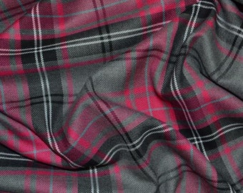 May include: A close-up of a pink and gray plaid fabric. The fabric is folded and has a soft, textured appearance.