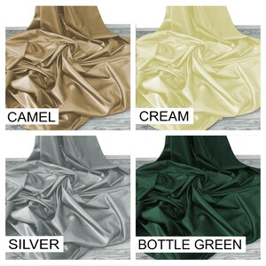 May include: Four fabric swatches in different colors: camel, cream, silver, and bottle green. The fabric is smooth and silky.