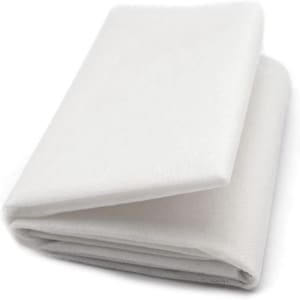 May include: White interfacing fabric, a lightweight, non-woven material used for stabilising and strengthening fabrics. It is often used in sewing and quilting projects.