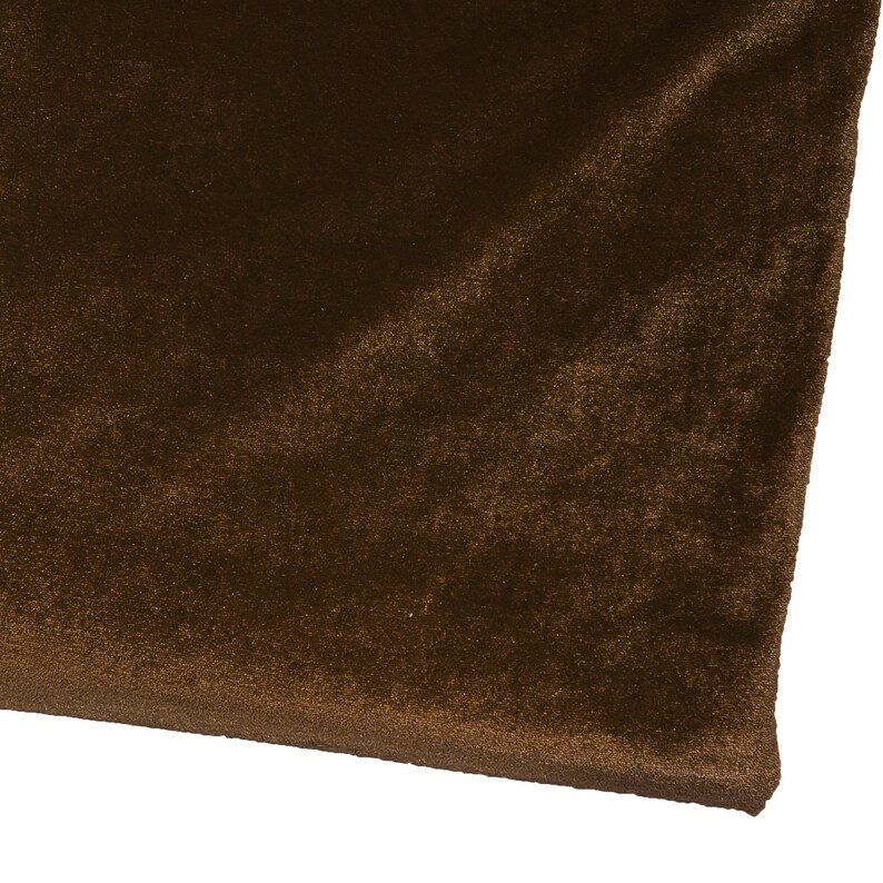 May include: A close-up of a piece of brown velvet fabric. The fabric has a soft, plush texture.