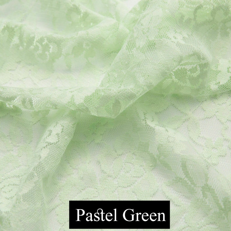 May include: Pale green lace fabric with a floral pattern. The fabric is soft and delicate, and it would be perfect for a variety of projects, such as clothing, accessories, and home decor.