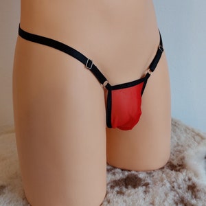 Könnte beinhalten: Rote Netz-Unterwäsche mit schwarzem Besatz und verstellbaren Trägern.