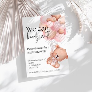 May include: A rectangular baby shower invitation card featuring a watercolor illustration of a brown teddy bear holding a cluster of pink and tan balloons. The text reads: We can bearly wait! Please join us for a BABY SHOWER, Saturday August 2nd at 2PM.