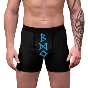 May include: Black boxer briefs with a vertical row of blue runes that spell "BMO".