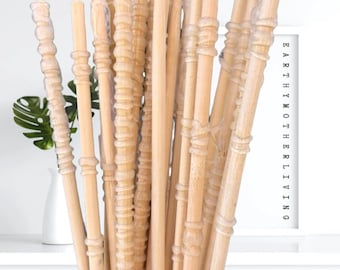 May include: A bundle of natural, light brown, wooden diffuser sticks with a clear, textured coating. The sticks are bundled together and appear to be ready for use in a diffuser.