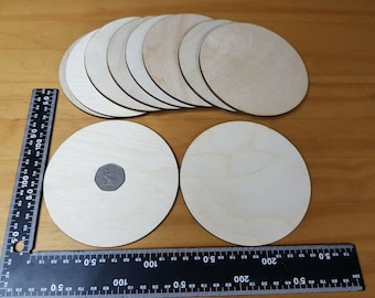 May include: A set of 10 unfinished wooden circles, perfect for crafting projects. The circles are approximately 3 inches in diameter and are made of natural wood.