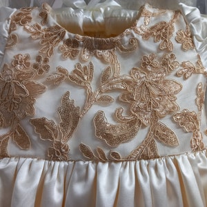 Beautiful satin child dress with lace bodice
