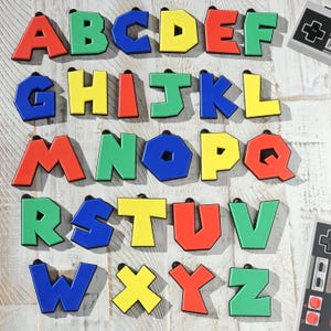 May include: A set of colorful foam alphabet letters in red, green, blue, and yellow. The letters are arranged in alphabetical order and are perfect for learning the alphabet.