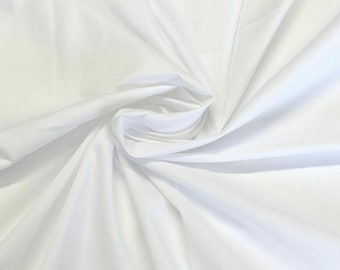 May include: White fabric with a smooth texture, folded and draped to show its softness.