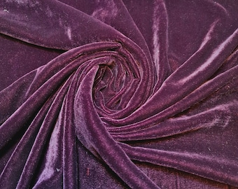 May include: A close-up of a deep purple velvet fabric, showcasing the soft texture and rich colour.