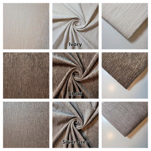 Puede incluir: Primer plano de tres muestras de tela en marfil, caqui y gris plateado. La tela tiene un aspecto texturizado y tejido.
