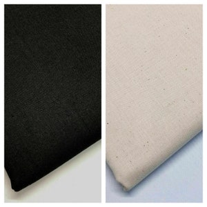 May include: Two fabric swatches, one black and one off-white. The fabric is woven and has a subtle texture.