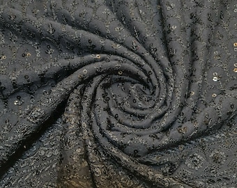 May include: Black fabric with a subtle floral pattern and small sequins throughout.