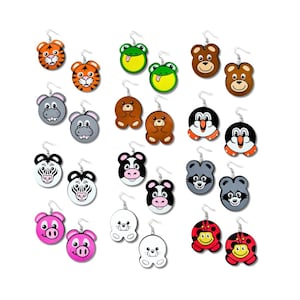 May include: A set of 20 colorful wooden earrings featuring various animal designs, including a zebra, a frog, a ladybug, a bear, a pig, a raccoon, a hippo, a seal, and a tiger.